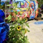 Colorful painted trailer and garden at Leoma Lovegrove Gallery in Matlacha Florida.