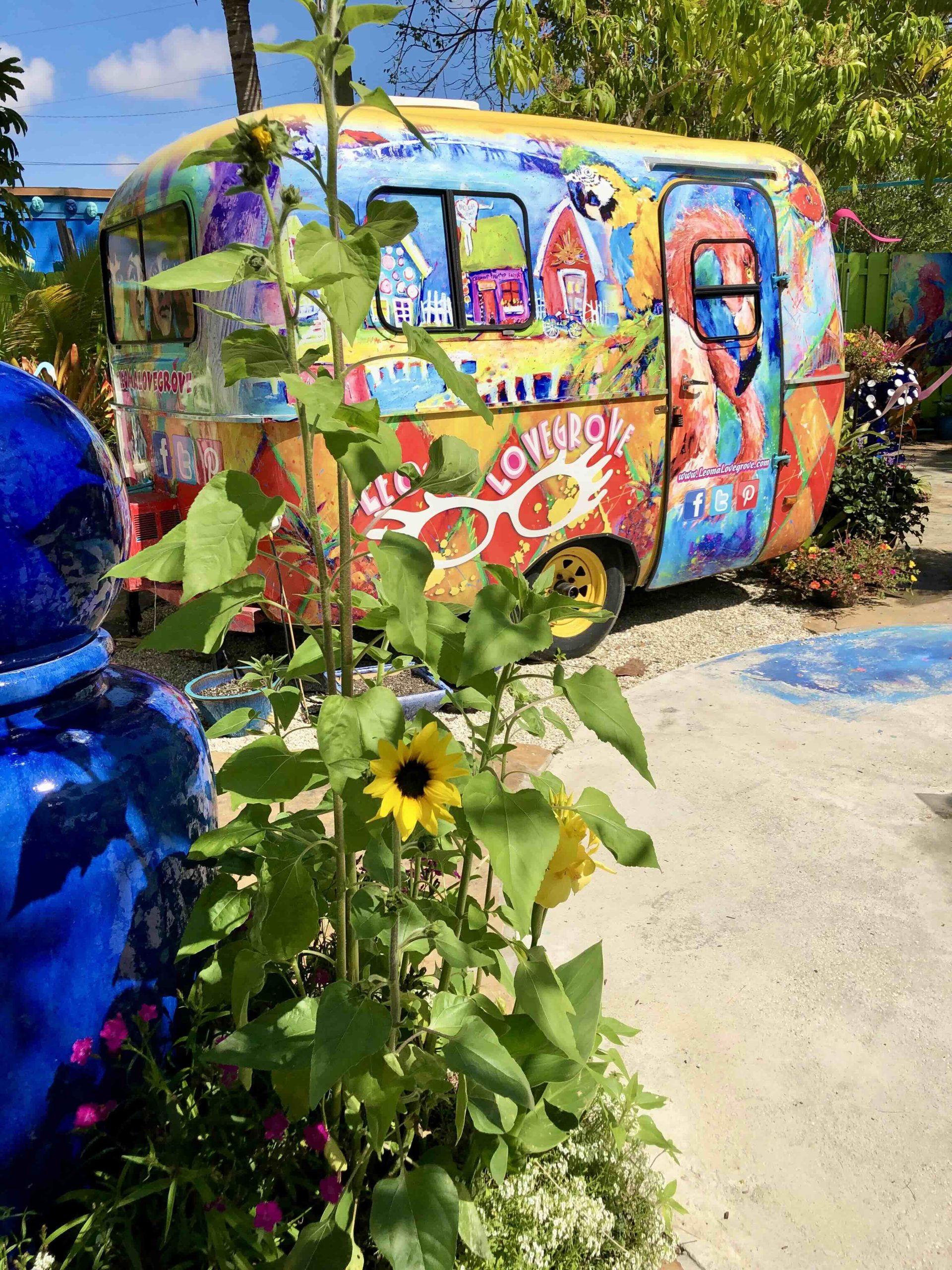 Colorful painted trailer and garden at Leoma Lovegrove Gallery in Matlacha Florida.