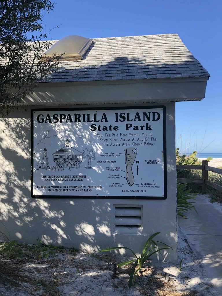 Gasparilla Island State Park sign showing Boca Grande beach access areas, lighthouses, and Gulf of Mexico shoreline