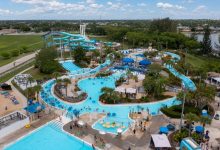 Aerial view of Sun Splash Family Waterpark in Cape Coral with slides, pools, lazy river, and Paradise Cove wave pool